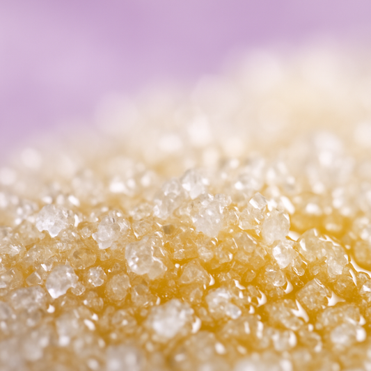Close-up of small sugar crystals on a gradient background